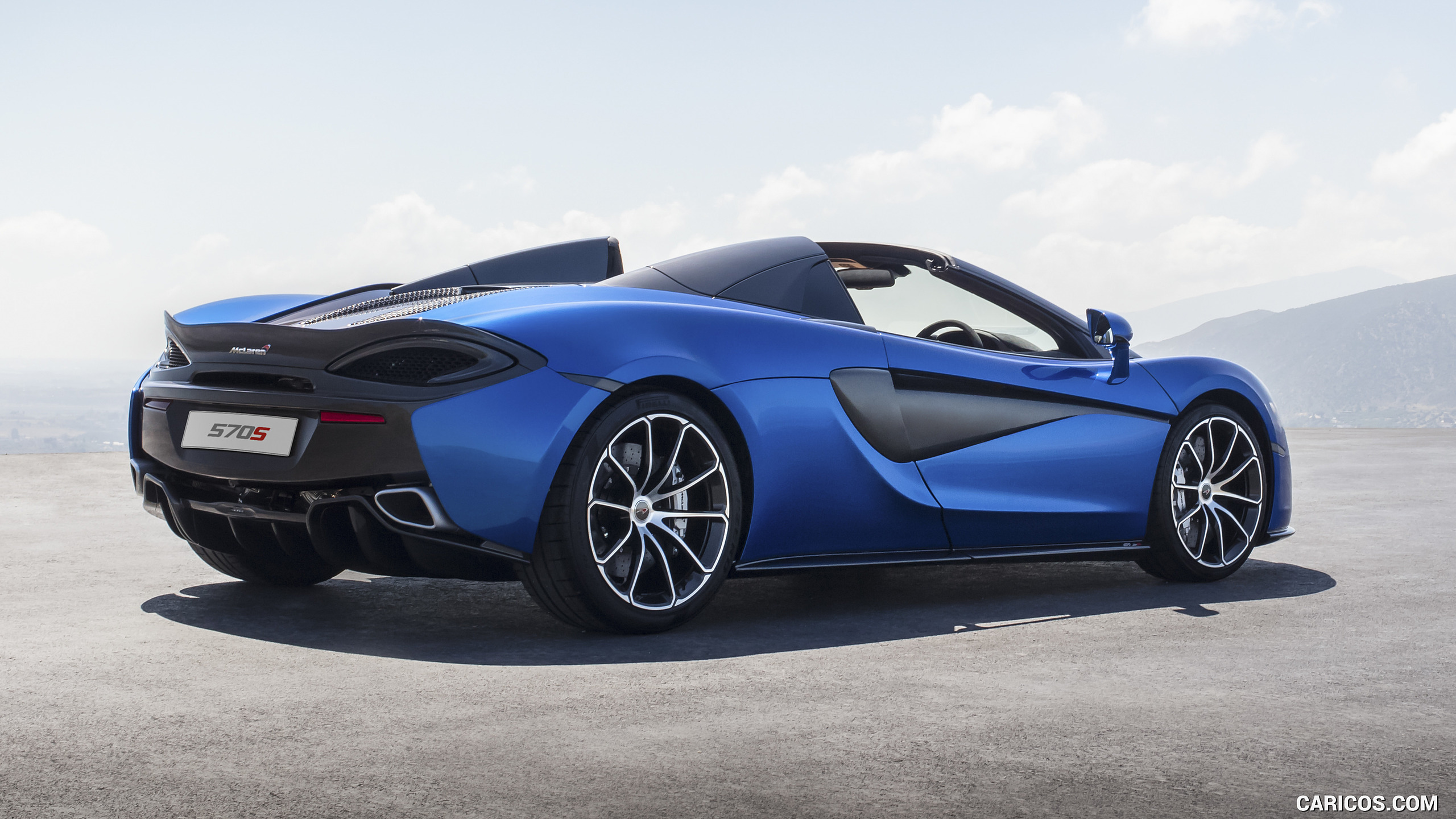 2018 Mclaren 570s Spider (color: Vega Blue) - Rear Three-quarter 