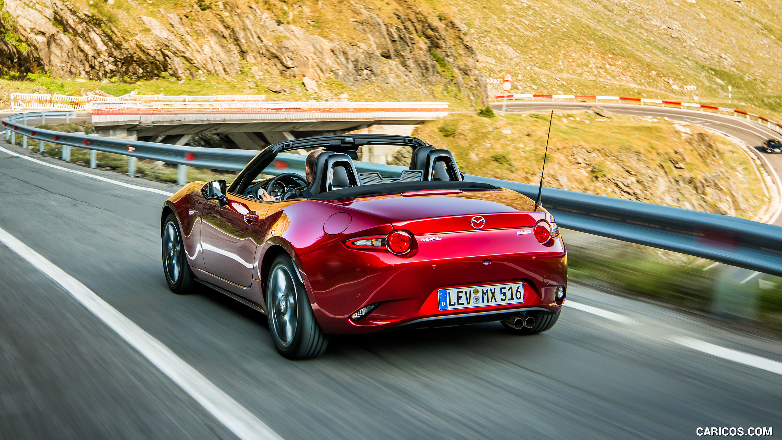 2019 Mazda MX-5 Roadster (Color: Soul Red Crystal) - Rear Three-Quarter, #16 of 101