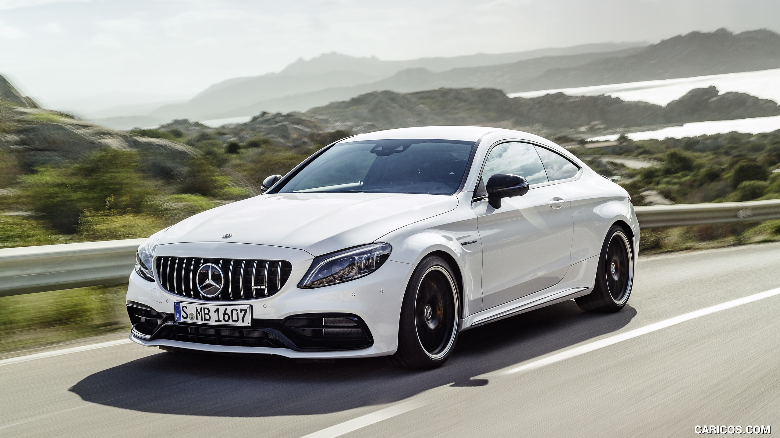 2019 Mercedes-AMG C 63 S Coupe with Night package and Carbon-package II (Color: Designo Diamond White Bright) - Front Three-Quarter, #1 of 106