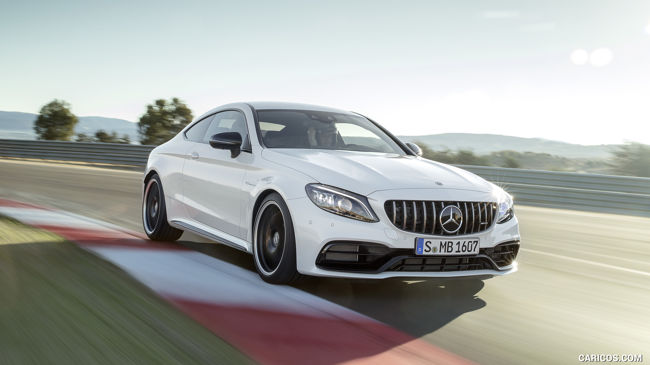 2019 Mercedes-AMG C 63 S Coupe with Night package and Carbon-package II (Color: Designo Diamond White Bright) - Front Three-Quarter, #3 of 106