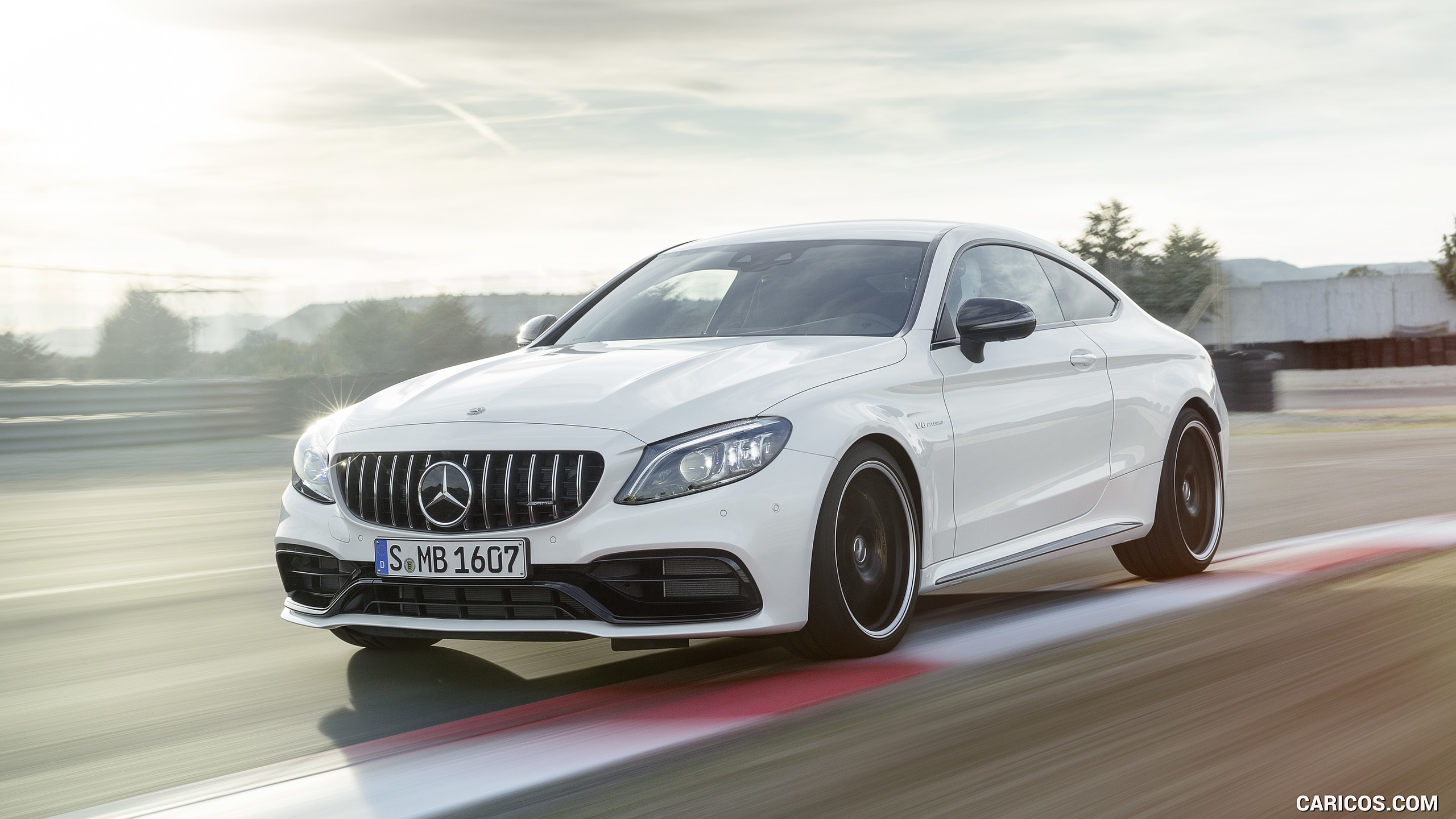 2019 Mercedes-AMG C 63 S Coupe with Night package and Carbon-package II (Color: Designo Diamond White Bright) - Front Three-Quarter, #5 of 106