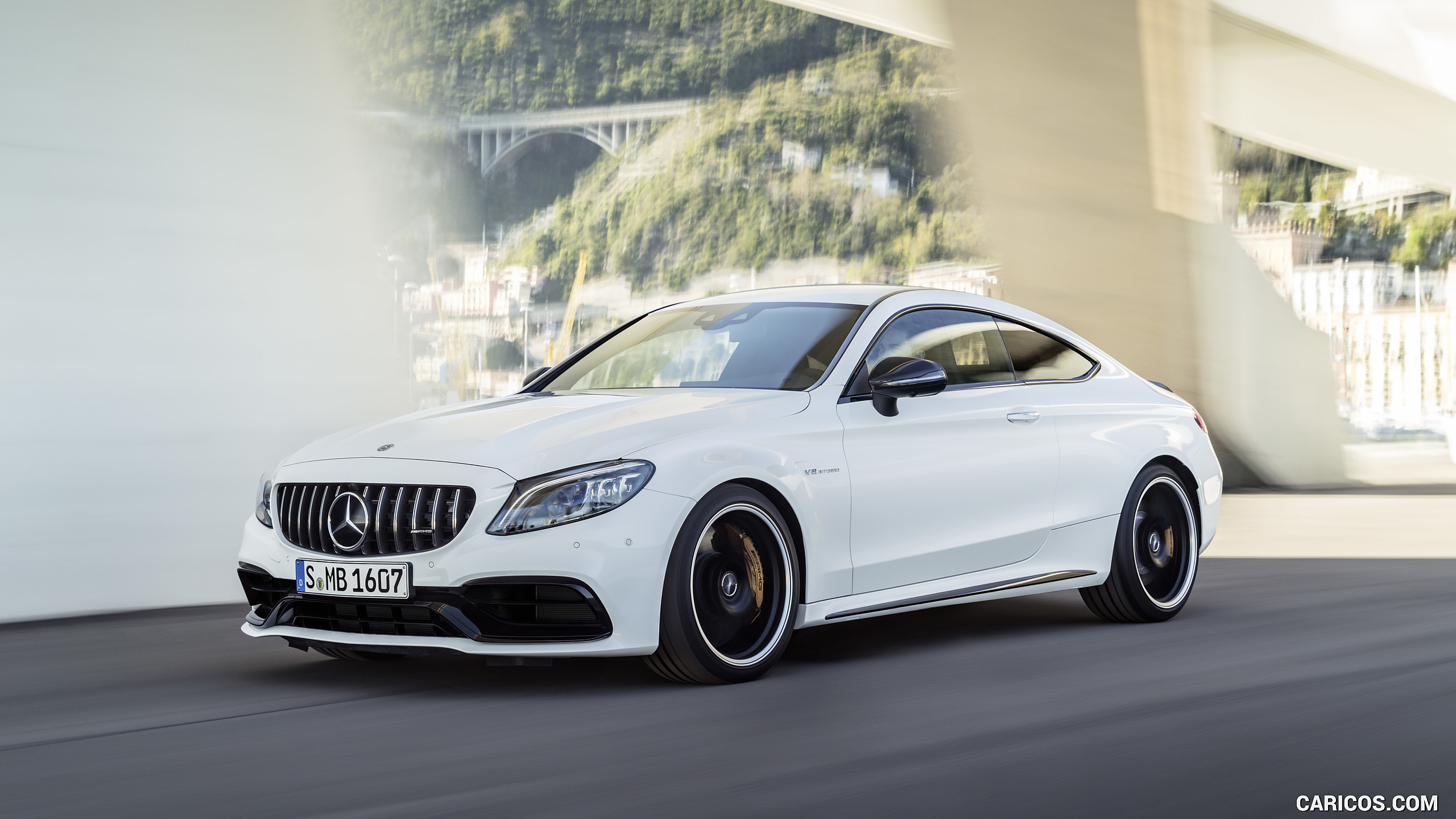 2019 Mercedes-AMG C 63 S Coupe with Night package and Carbon-package II (Color: Designo Diamond White Bright) - Front Three-Quarter, #11 of 106
