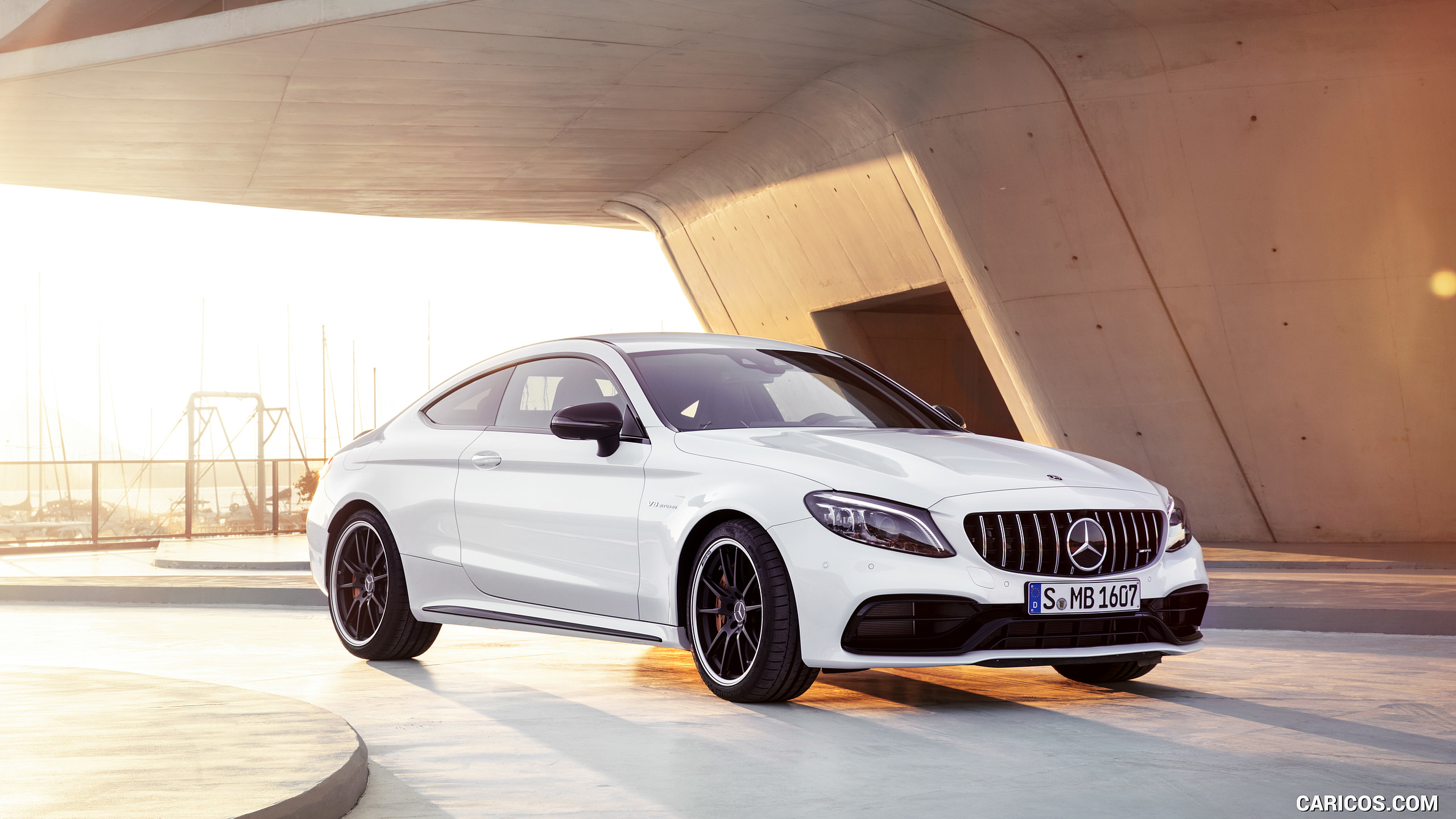 2019 Mercedes-AMG C 63 S Coupe with Night package and Carbon-package II (Color: Designo Diamond White Bright) - Front Three-Quarter, #12 of 106