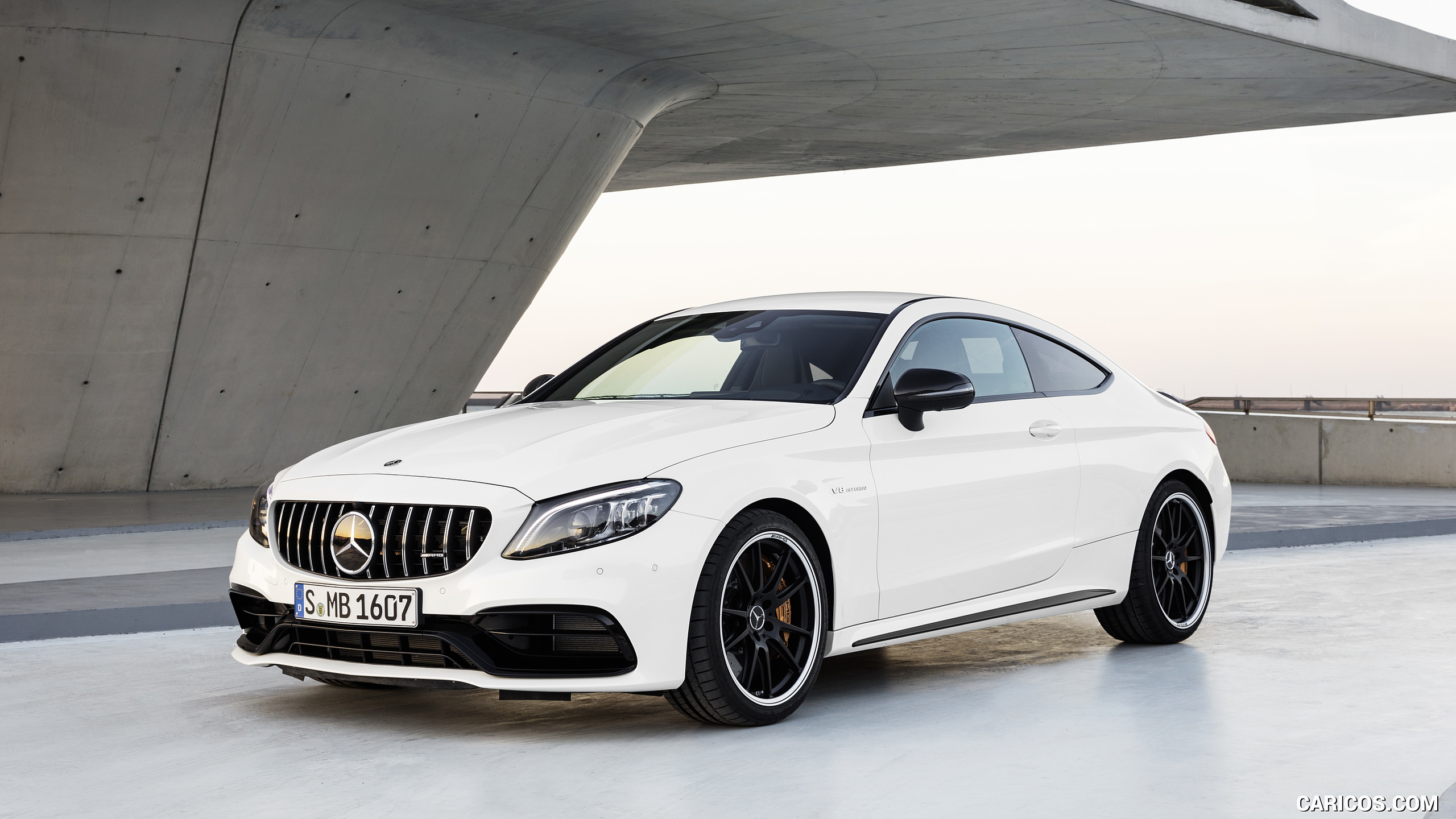 2019 Mercedes-AMG C 63 S Coupe with Night package and Carbon-package II (Color: Designo Diamond White Bright) - Front Three-Quarter, #13 of 106