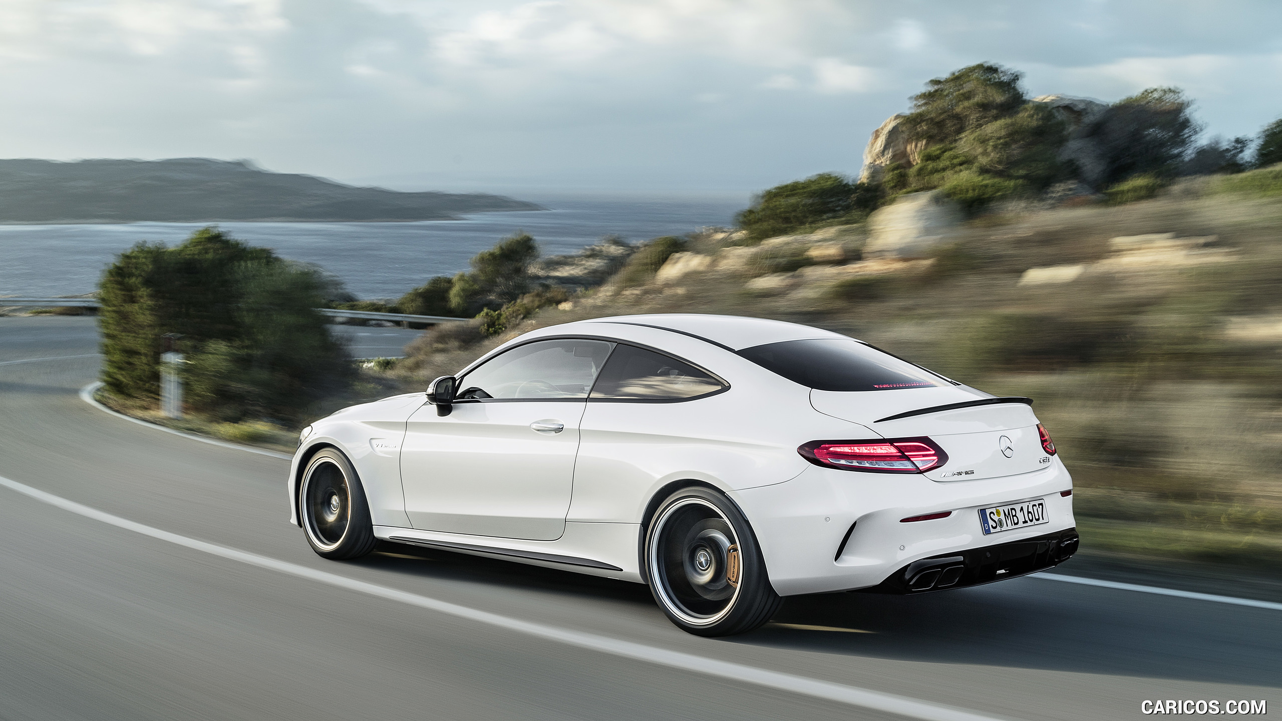 2019 Mercedes-AMG C 63 S Coupe with Night package and Carbon-package II (Color: Designo Diamond White Bright) - Rear Three-Quarter, #8 of 106