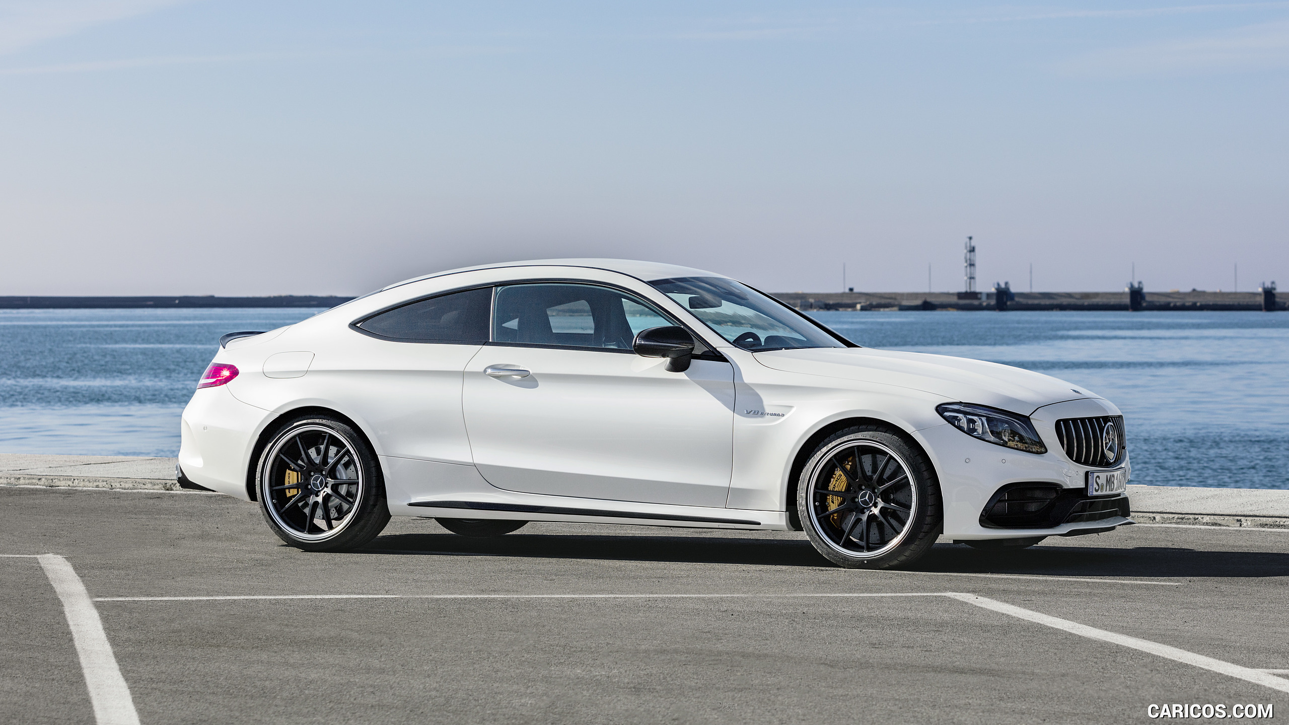 2019 Mercedes-AMG C 63 S Coupe with Night package and Carbon-package II (Color: Designo Diamond White Bright) - Side, #16 of 106