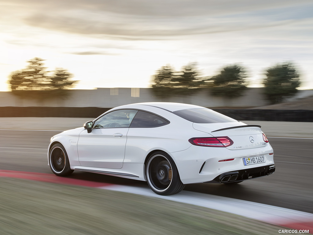 2019 Mercedes-AMG C 63 S Coupe with Night package and Carbon-package II (Color: Designo Diamond White Bright) - Rear Three-Quarter