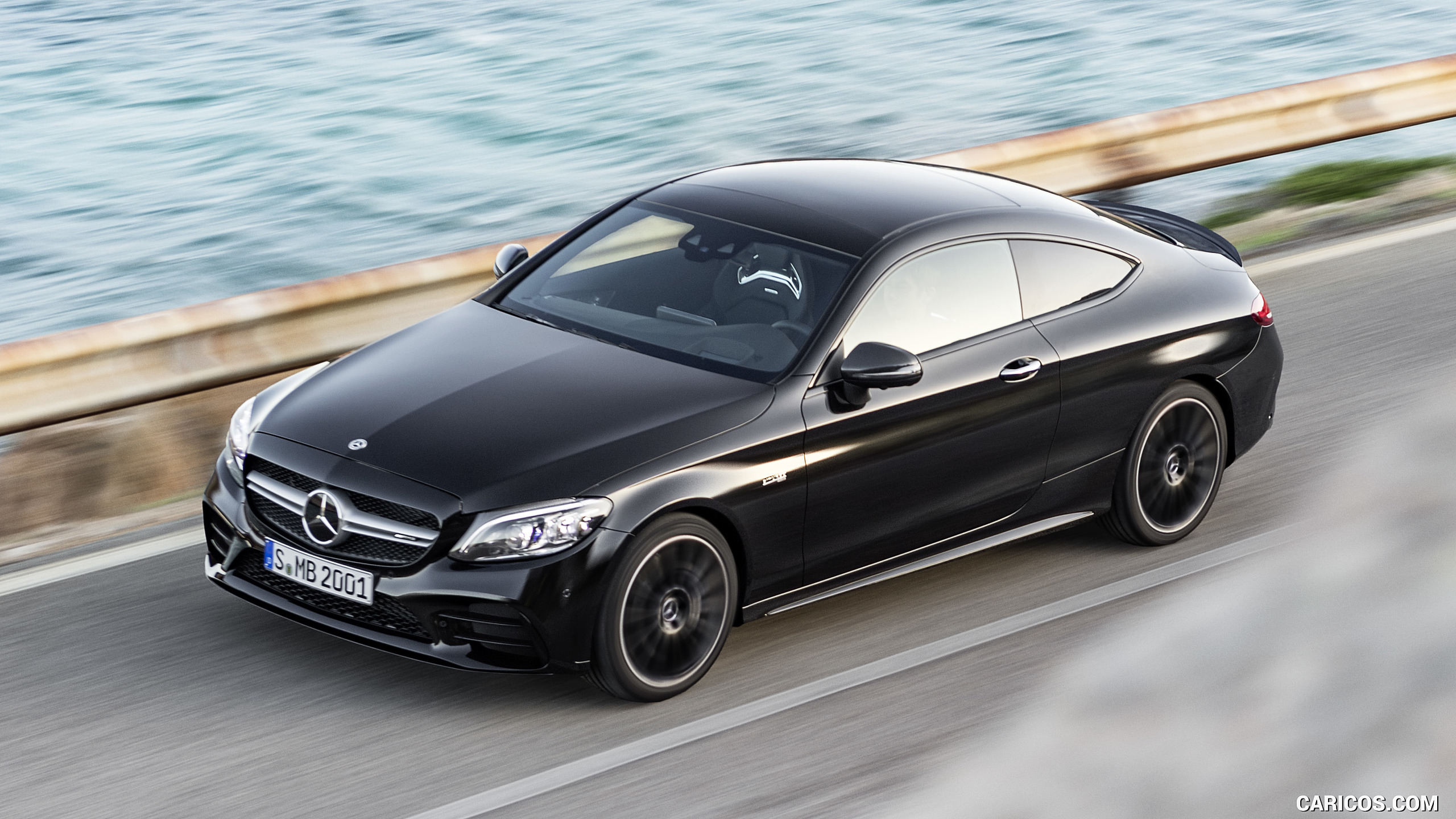 2019 Mercedes-AMG C43 Coupe 4MATIC Night Package and AMG Carbon-Package II (Color: Obsidian Black Metallic) - Front Three-Quarter, #10 of 184