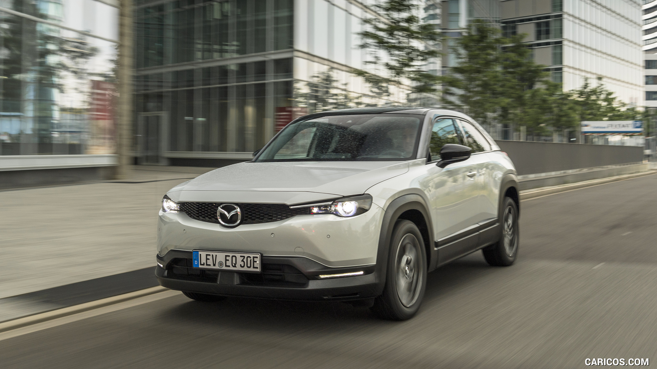 2021 Mazda MX-30 EV (Color: Ceramic White) - Front Three-Quarter | Caricos