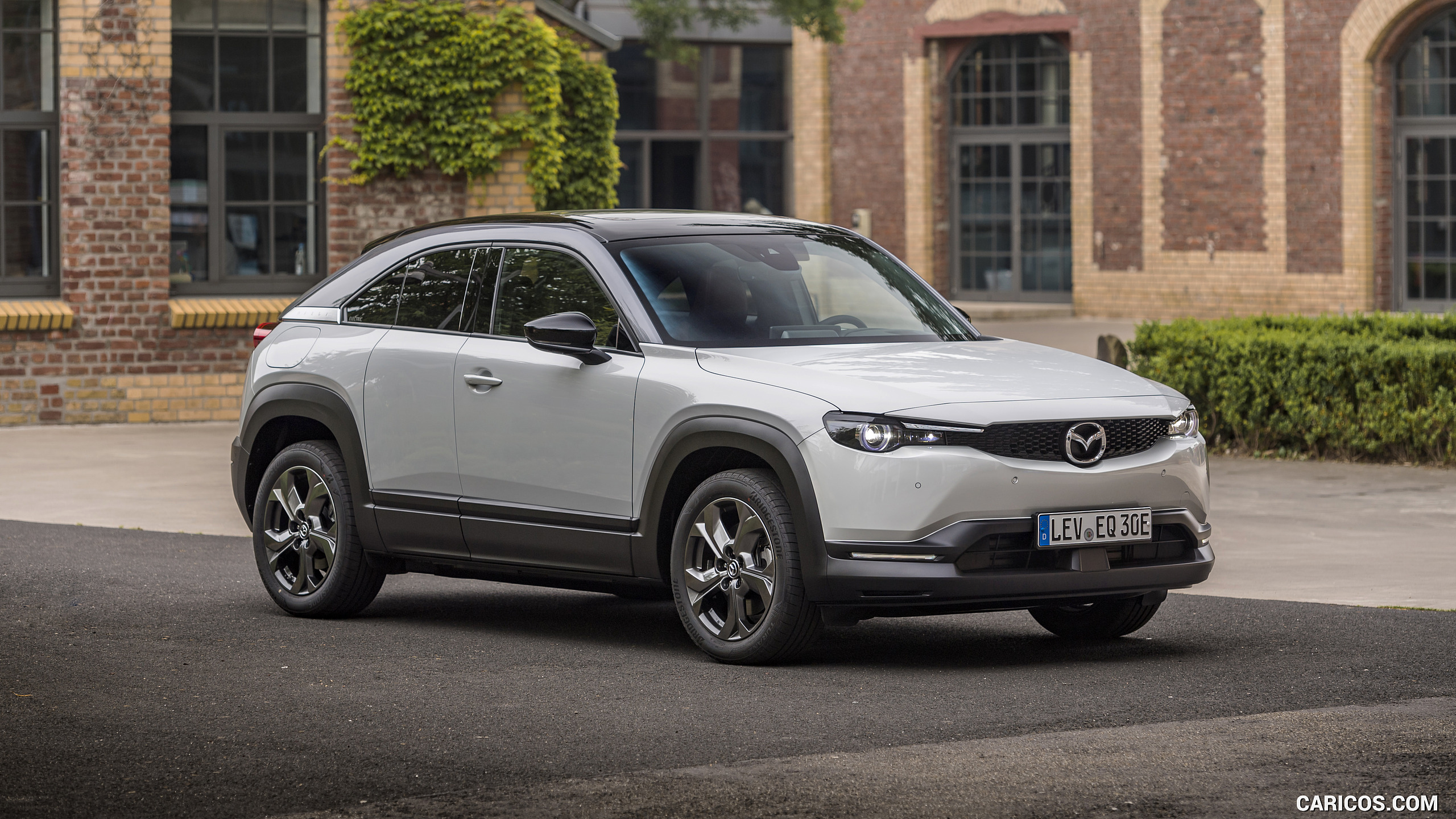 2021 Mazda MX-30 EV (Color: Ceramic-White) - Front Three-Quarter | Caricos