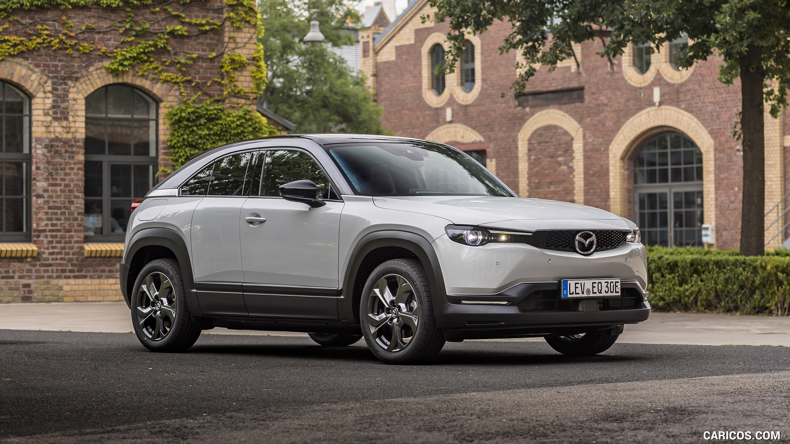 2021 Mazda MX-30 EV (Color: Ceramic-White) - Front Three-Quarter | Caricos