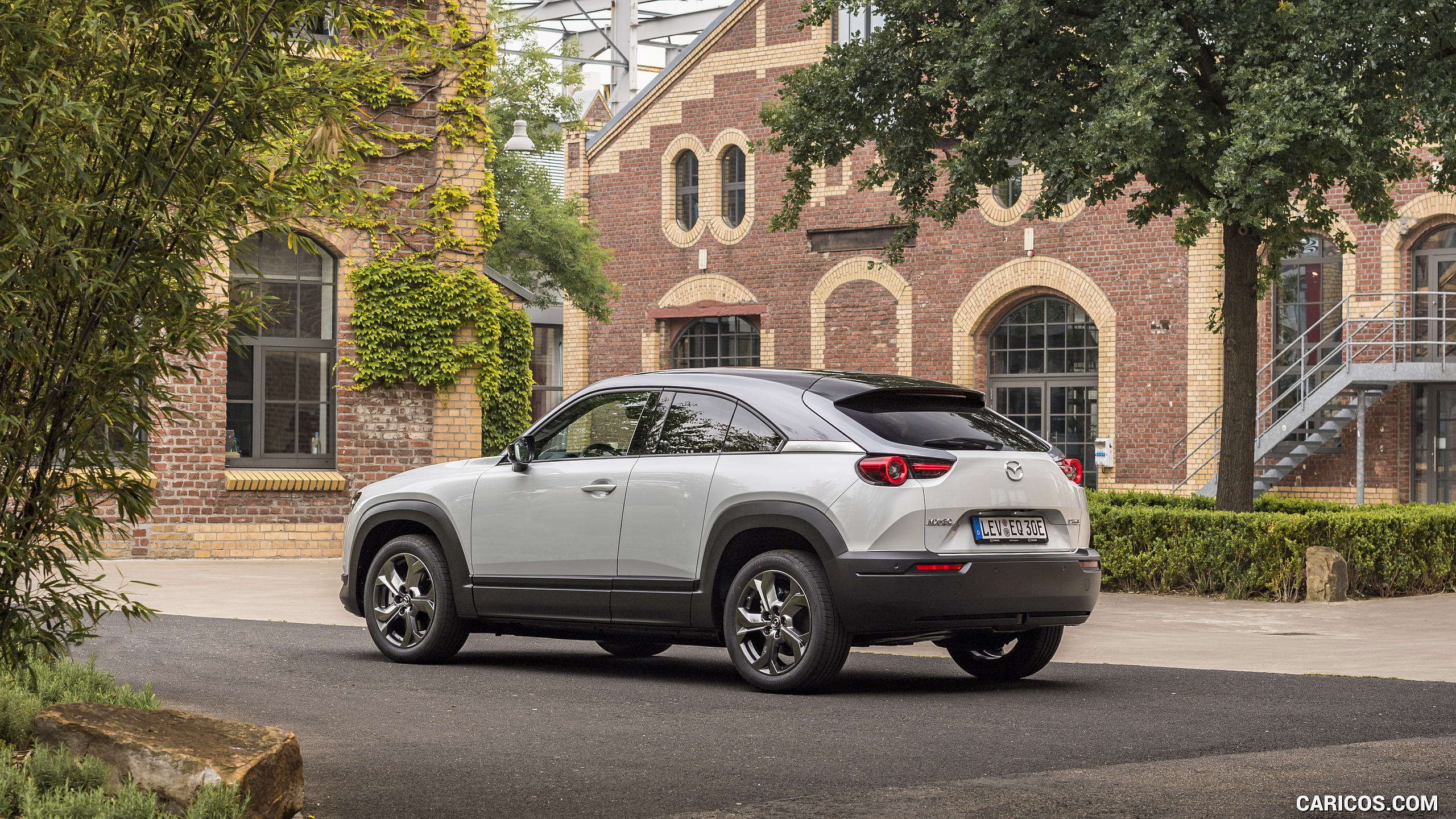 2021 Mazda MX-30 EV (Color: Ceramic-White) - Rear Three-Quarter | Caricos