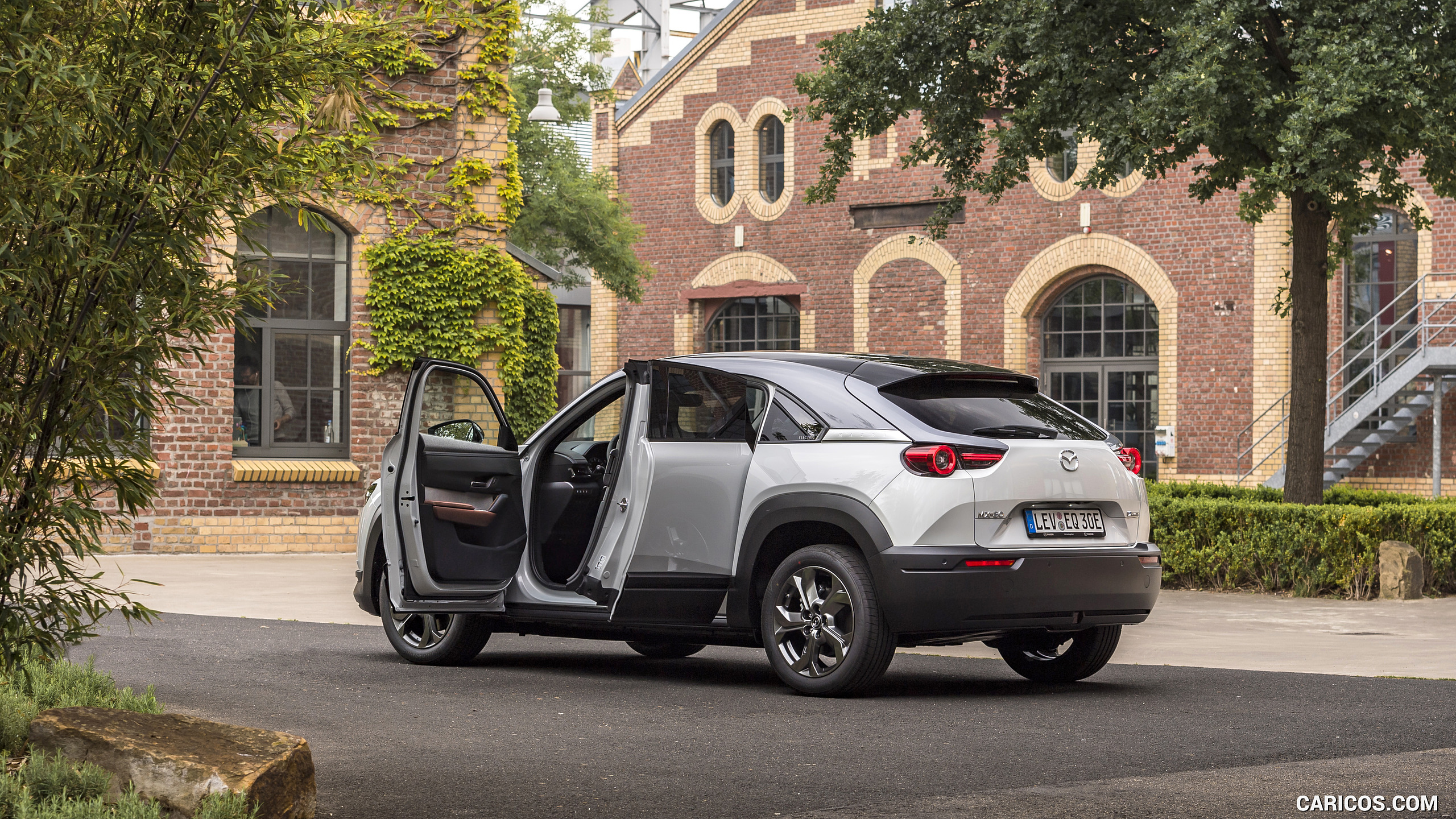 2021 Mazda MX-30 EV (Color: Ceramic-White) - Rear Three-Quarter | Caricos