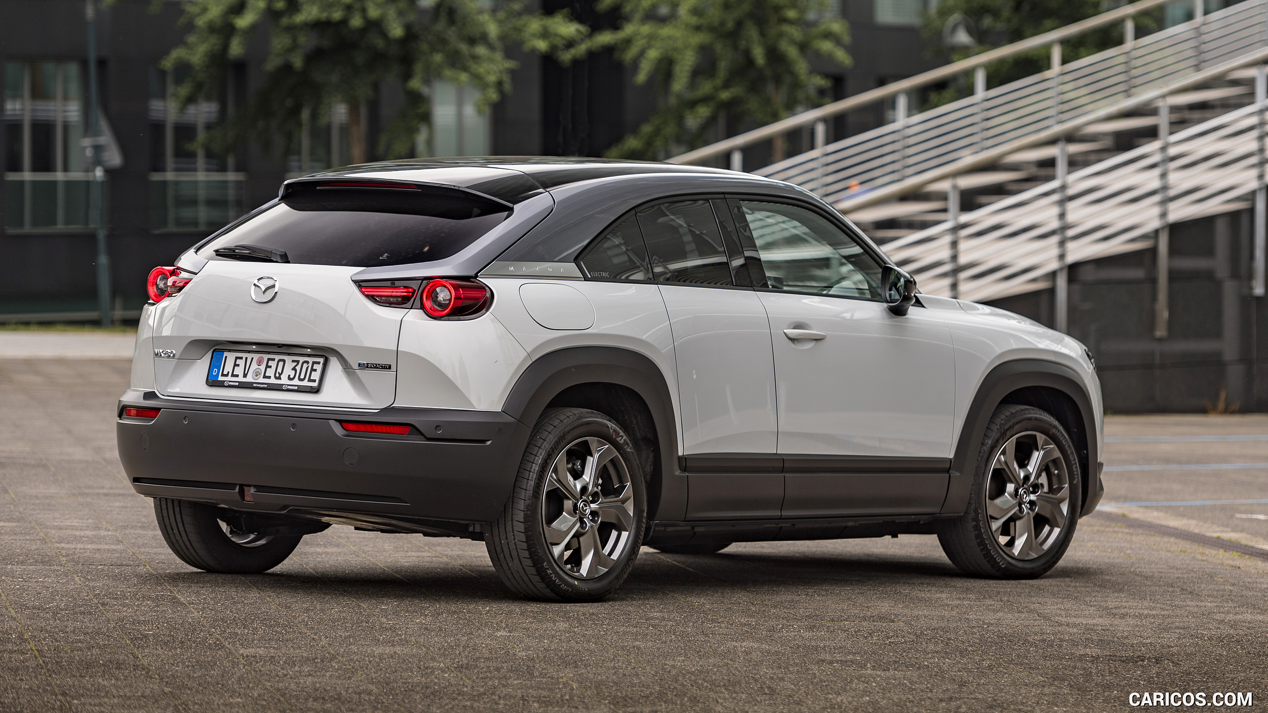 2021 Mazda MX-30 EV (Color: Ceramic White) - Rear Three-Quarter | Caricos