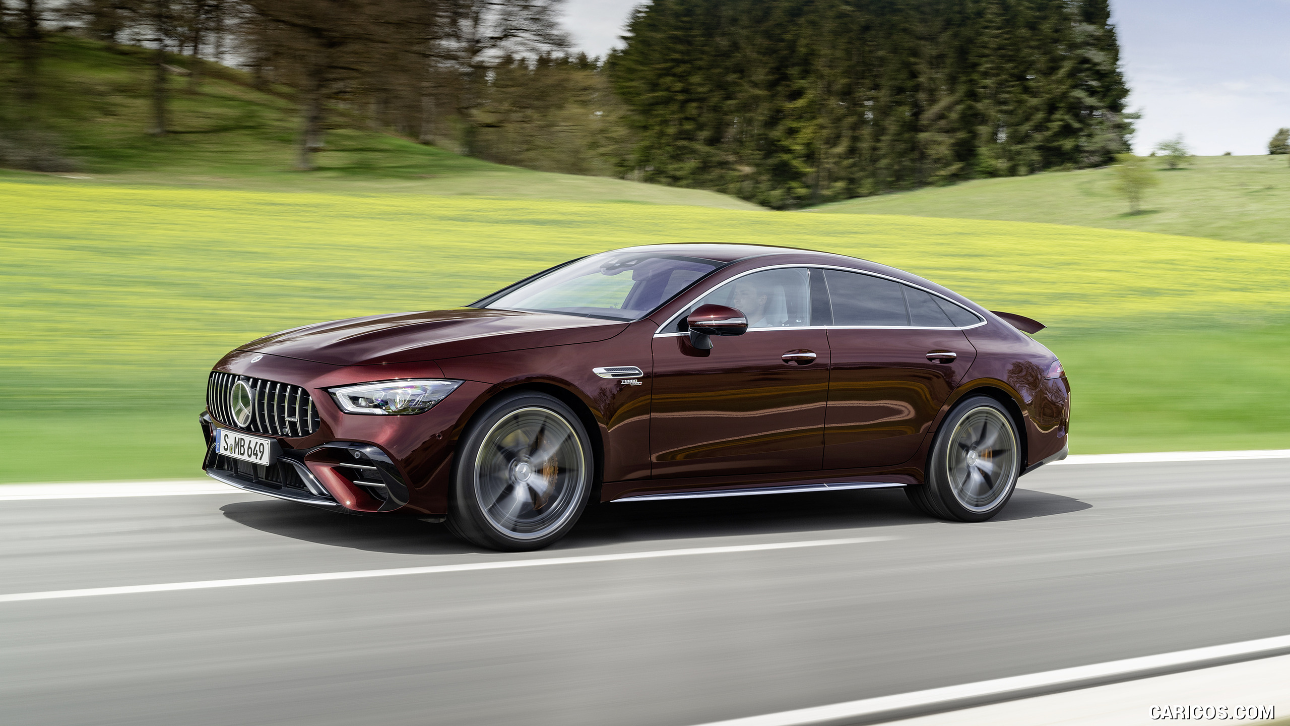 2022 Mercedes-AMG GT 53 4MATIC+ 4-Door Coupe (Color: Rubellite Red) - Front Three-Quarter, #2 of 35