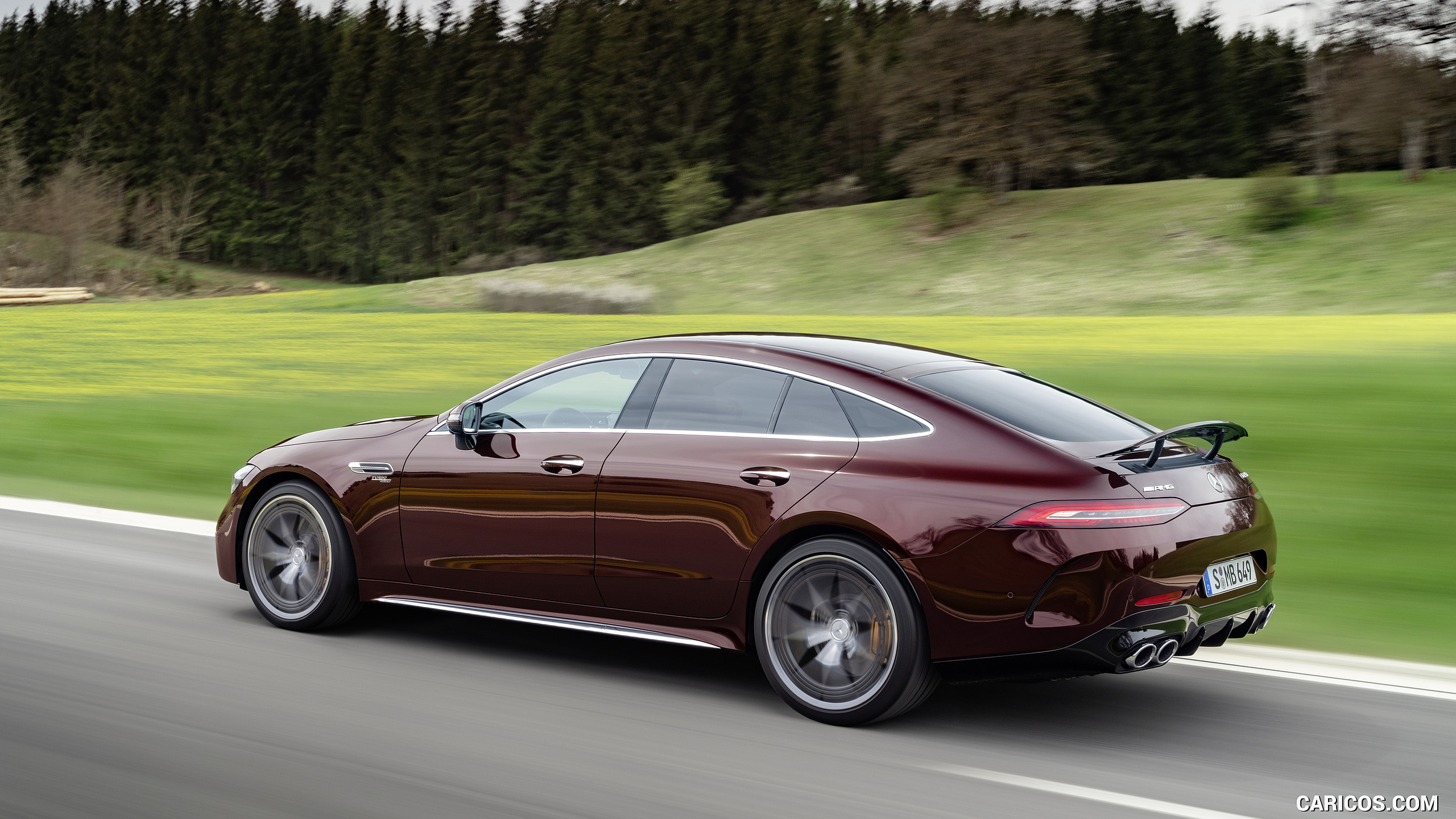 2022 Mercedes-AMG GT 53 4MATIC+ 4-Door Coupe (Color: Rubellite Red) - Rear Three-Quarter, #4 of 35
