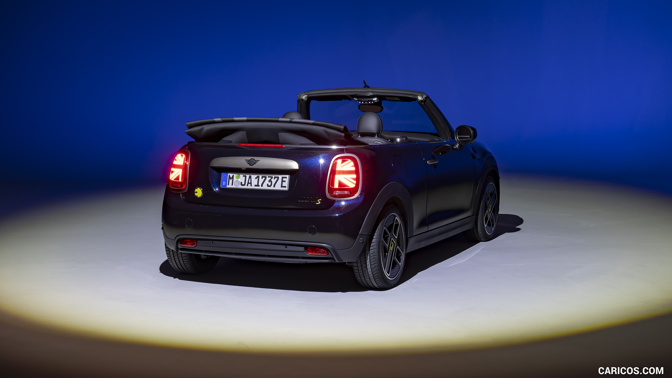 2023 MINI Cooper SE Convertible (Color: Enigmatic Black) - Rear Three-Quarter, #210 of 225