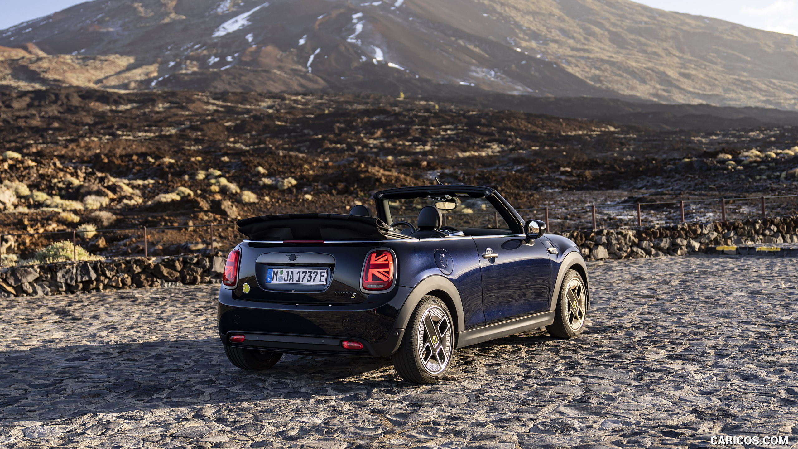 2023 MINI Cooper SE Convertible - Rear Three-Quarter | Caricos