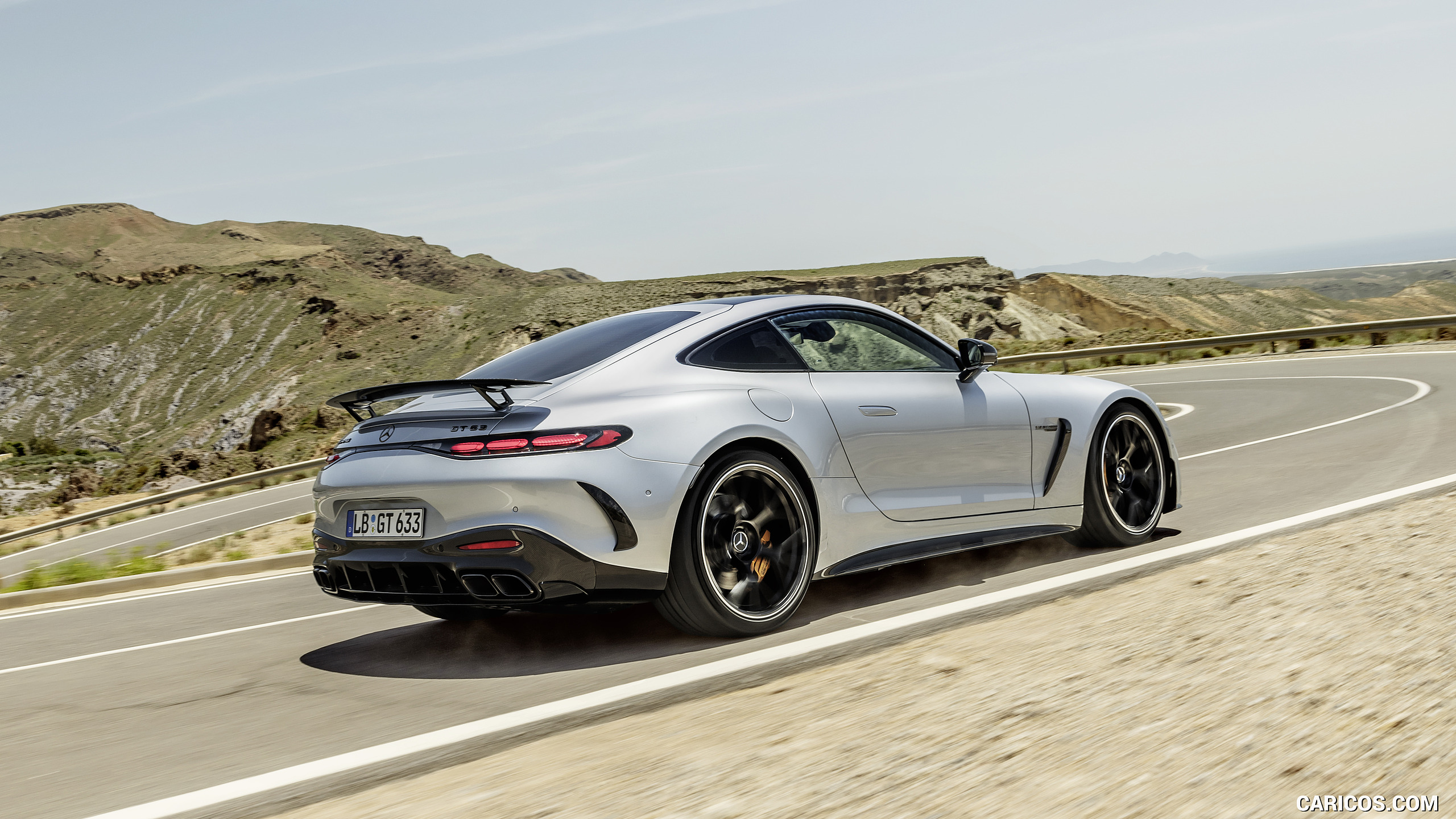 2024 Mercedes-AMG GT 63 Coupé 4MATIC+ with AMG Aerodynamic package (Color: High-Tech Silver Metallic) - Rear Three-Quarter, #4 of 62