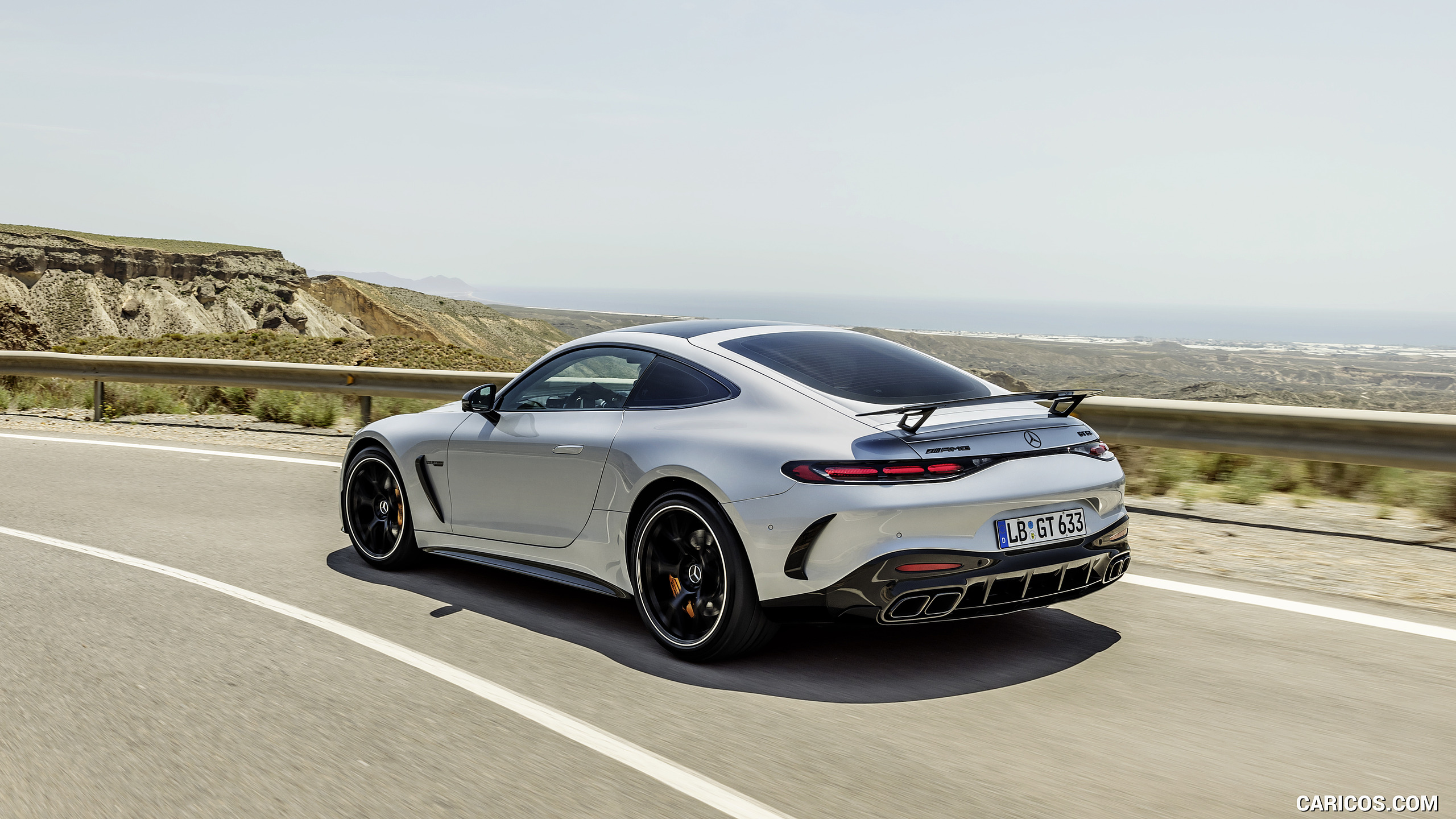 2024 Mercedes-AMG GT 63 Coupé 4MATIC+ with AMG Aerodynamic package (Color: High-Tech Silver Metallic) - Rear Three-Quarter, #5 of 241