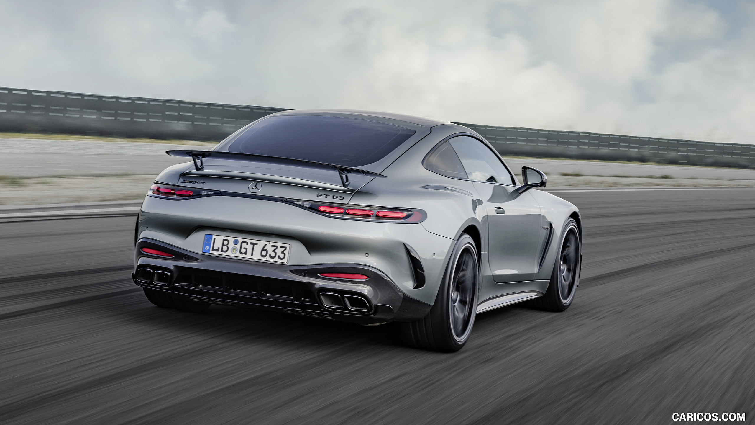 2024 Mercedes-AMG GT 63 Coupé 4MATIC+ with AMG Aerodynamic package (Color: High-Tech Silver Metallic) - Rear Three-Quarter, #10 of 62