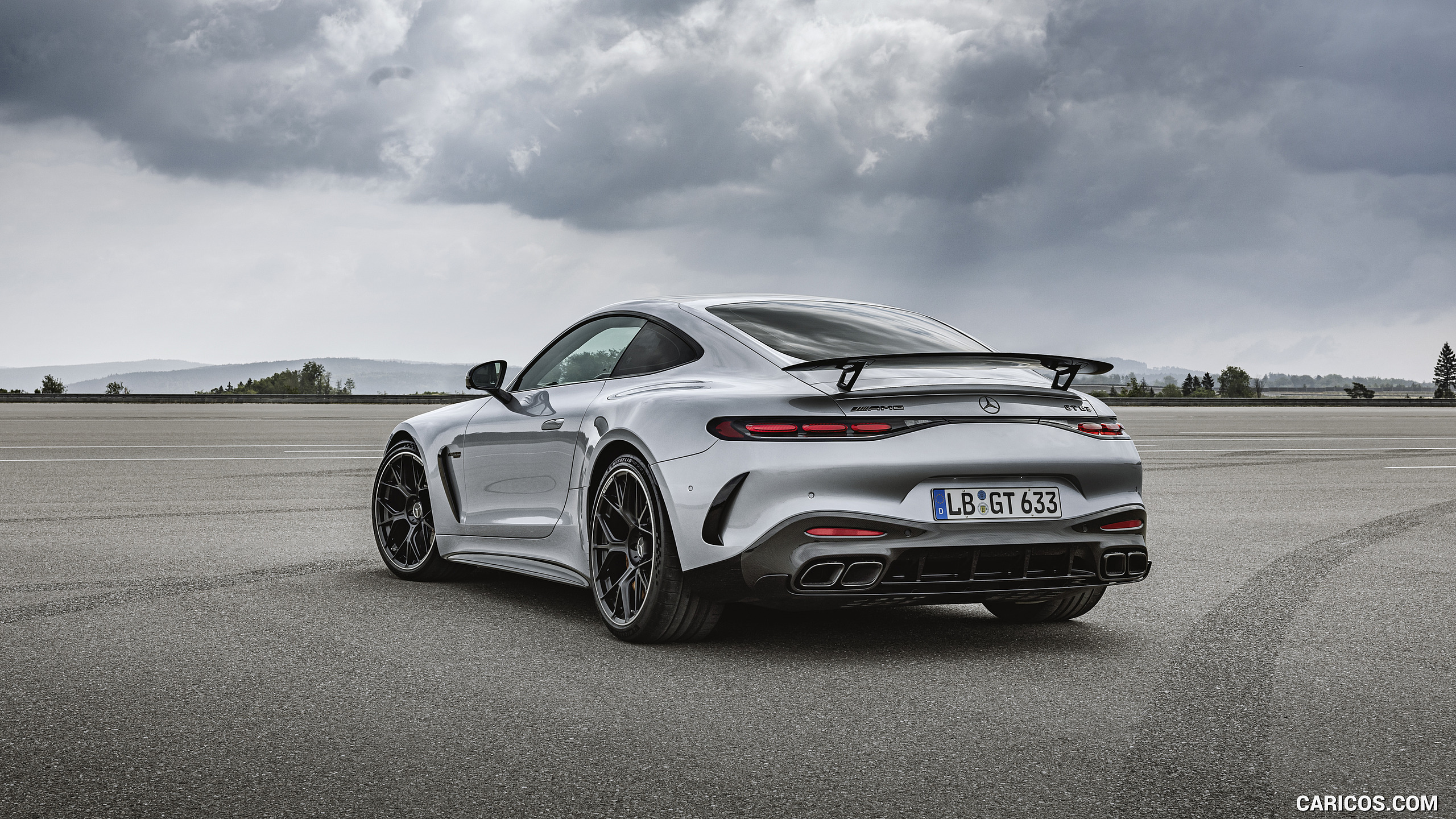 2024 Mercedes-AMG GT 63 Coupé 4MATIC+ with AMG Aerodynamic package (Color: High-Tech Silver Metallic) - Rear Three-Quarter, #24 of 241