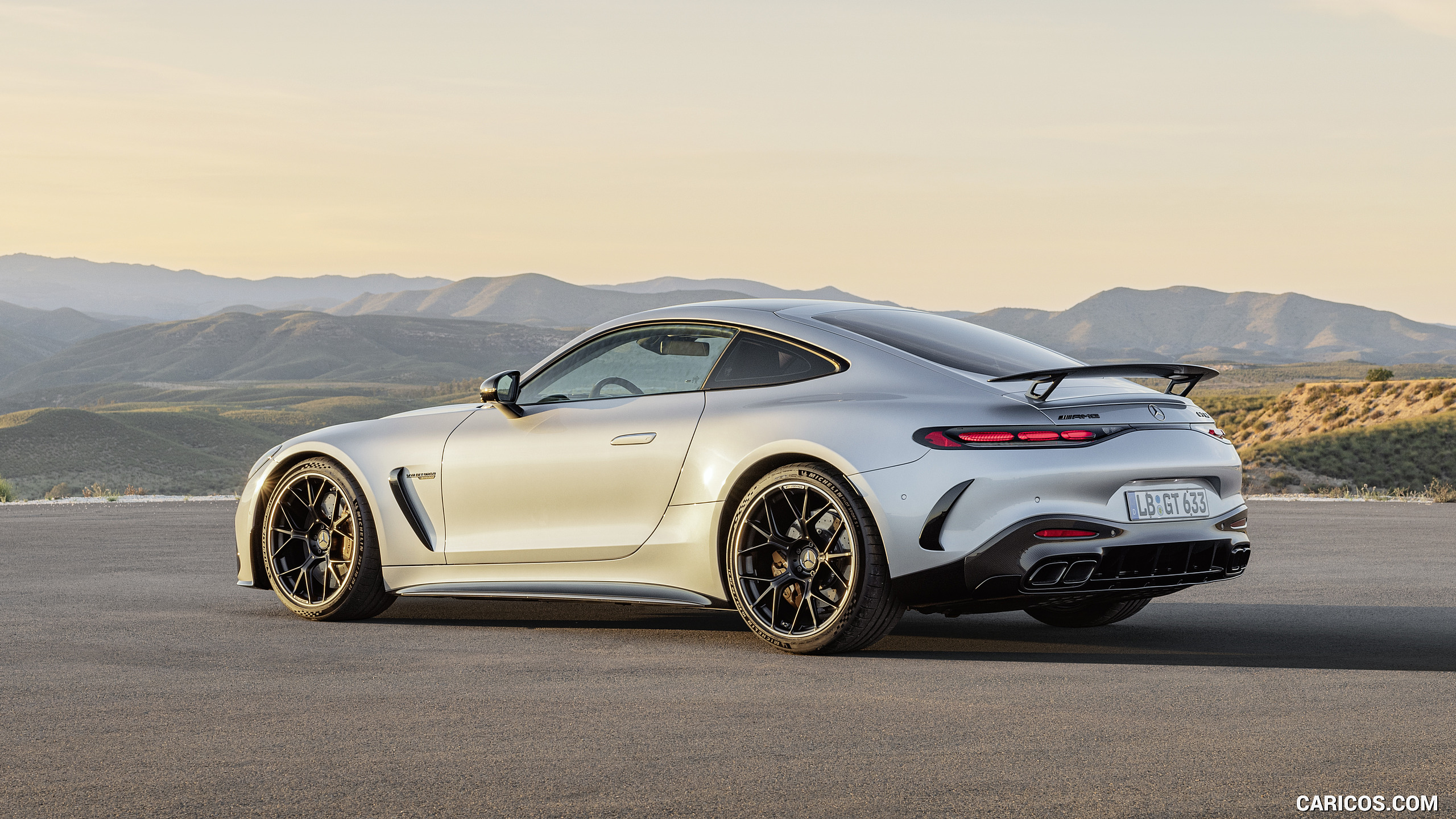 2024 Mercedes-AMG GT 63 Coupé 4MATIC+ with AMG Aerodynamic package (Color: High-Tech Silver Metallic) - Rear Three-Quarter, #31 of 241