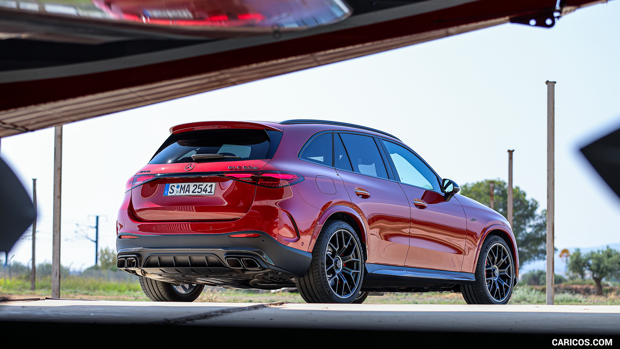 2025 Mercedes-AMG GLC 63 S E PERFORMANCE (Color: Patagonia Red Metallic) - Rear Three-Quarter, #119 of 210