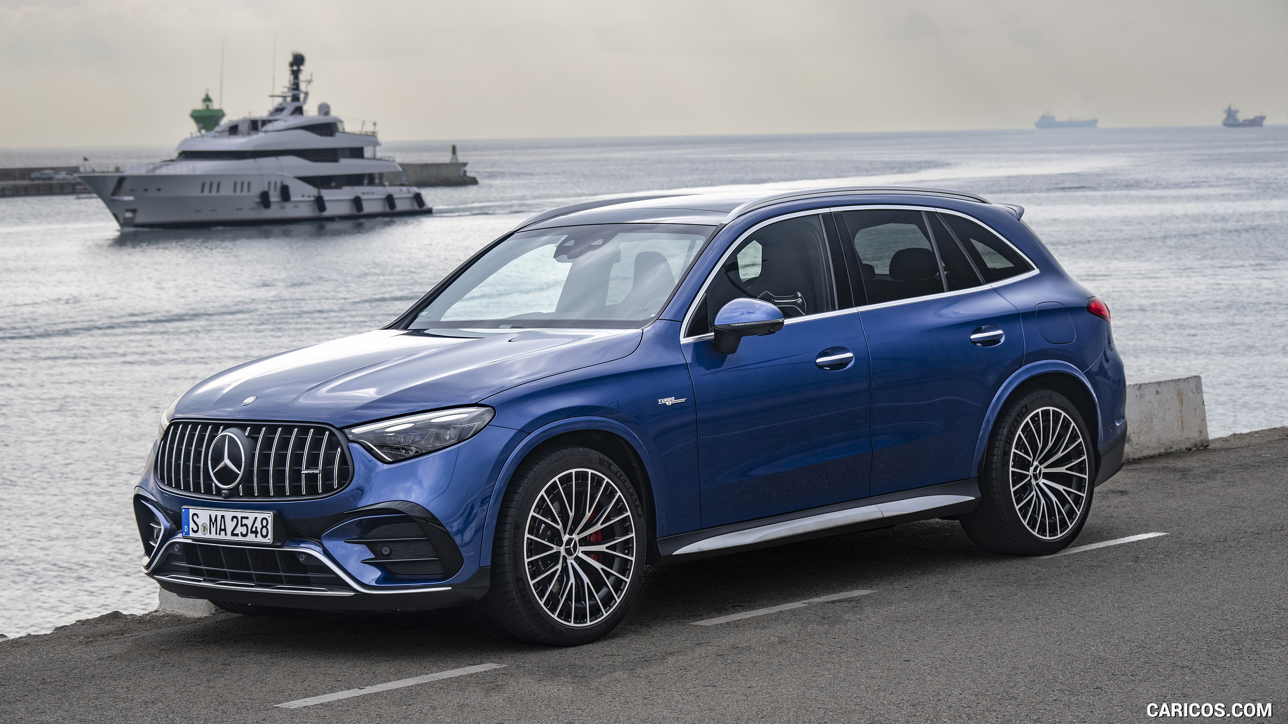 2025 Mercedes-AMG GLC 63 S E PERFORMANCE (Color: Spectral Blue Metallic) - Front Three-Quarter, #22 of 210