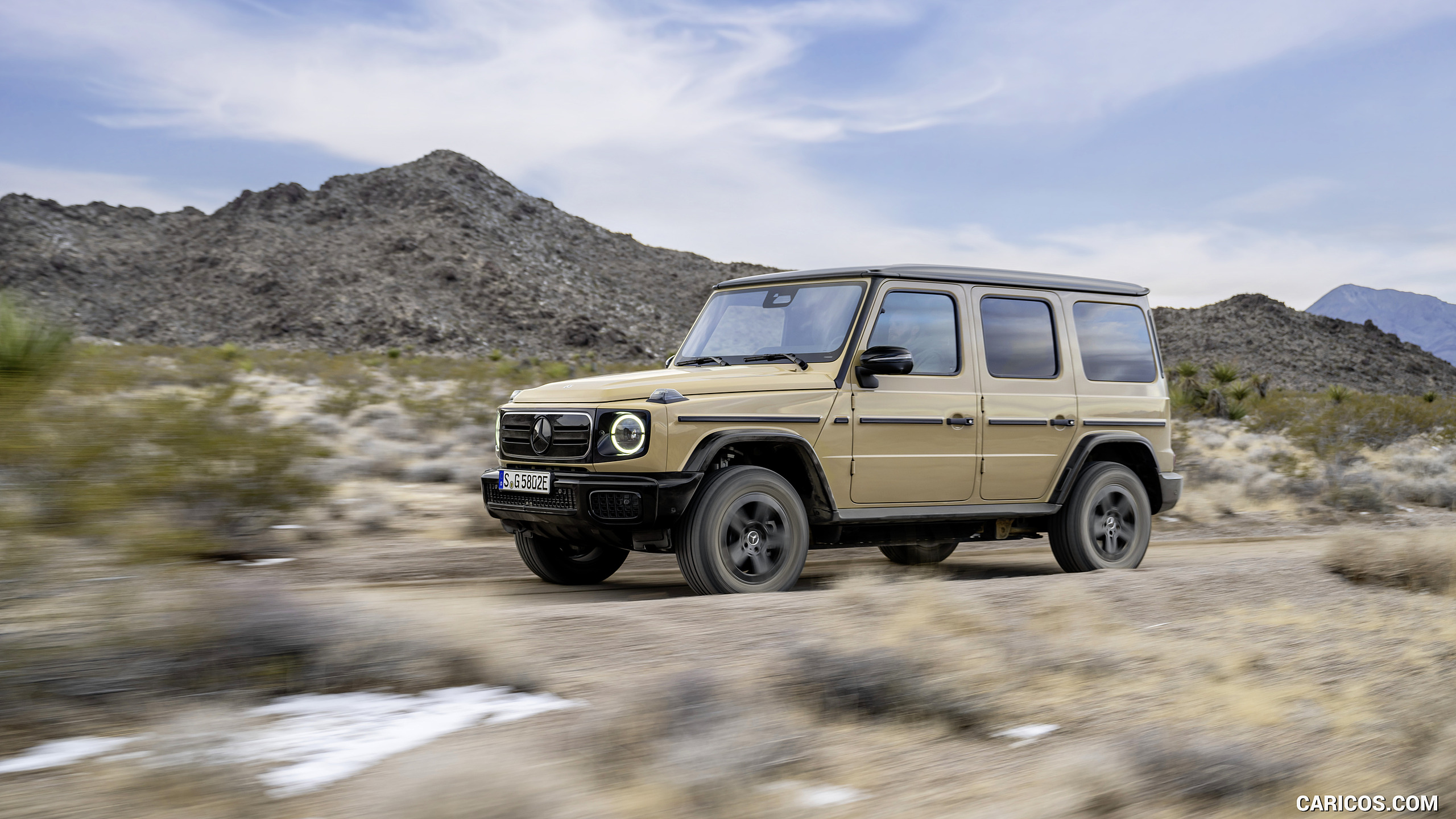 2025 Mercedes-Benz G 580 Electric with EQ Technology (Color: MANUFAKTUR Desert Sand Non-Metallic) - Front Three-Quarter, #32 of 107