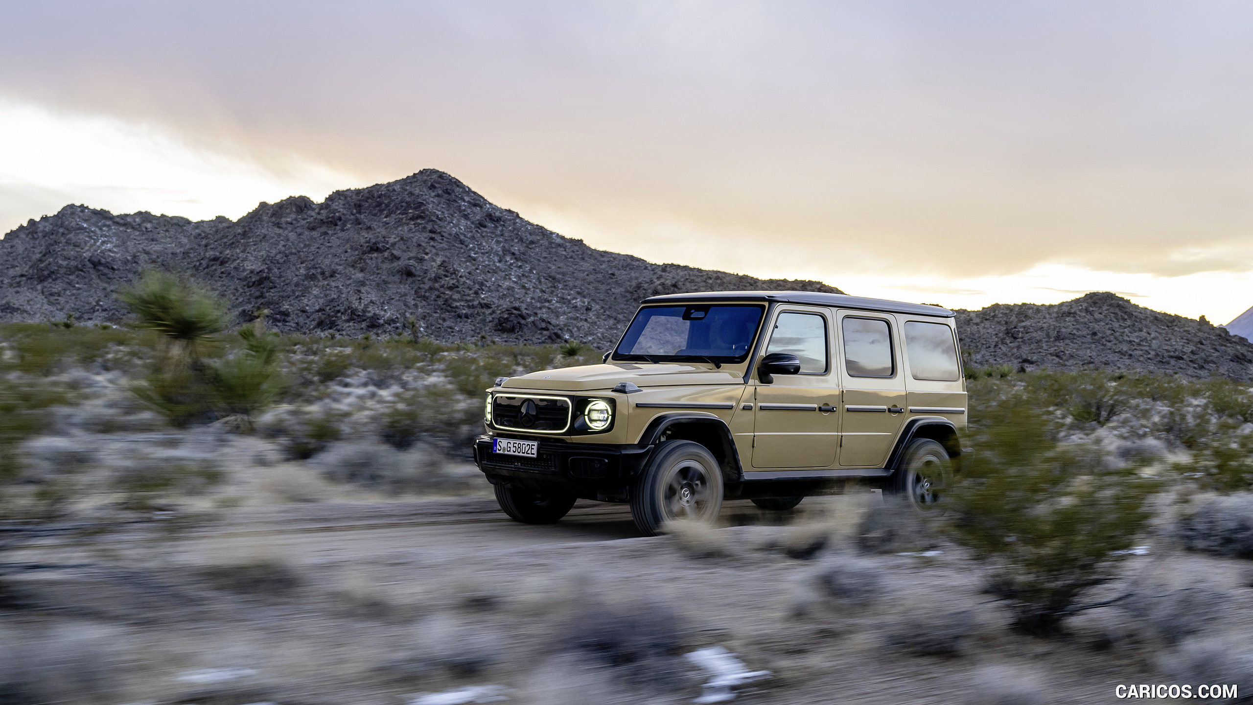 2025 Mercedes-Benz G 580 Electric with EQ Technology (Color: MANUFAKTUR Desert Sand Non-Metallic) - Front Three-Quarter, #35 of 107