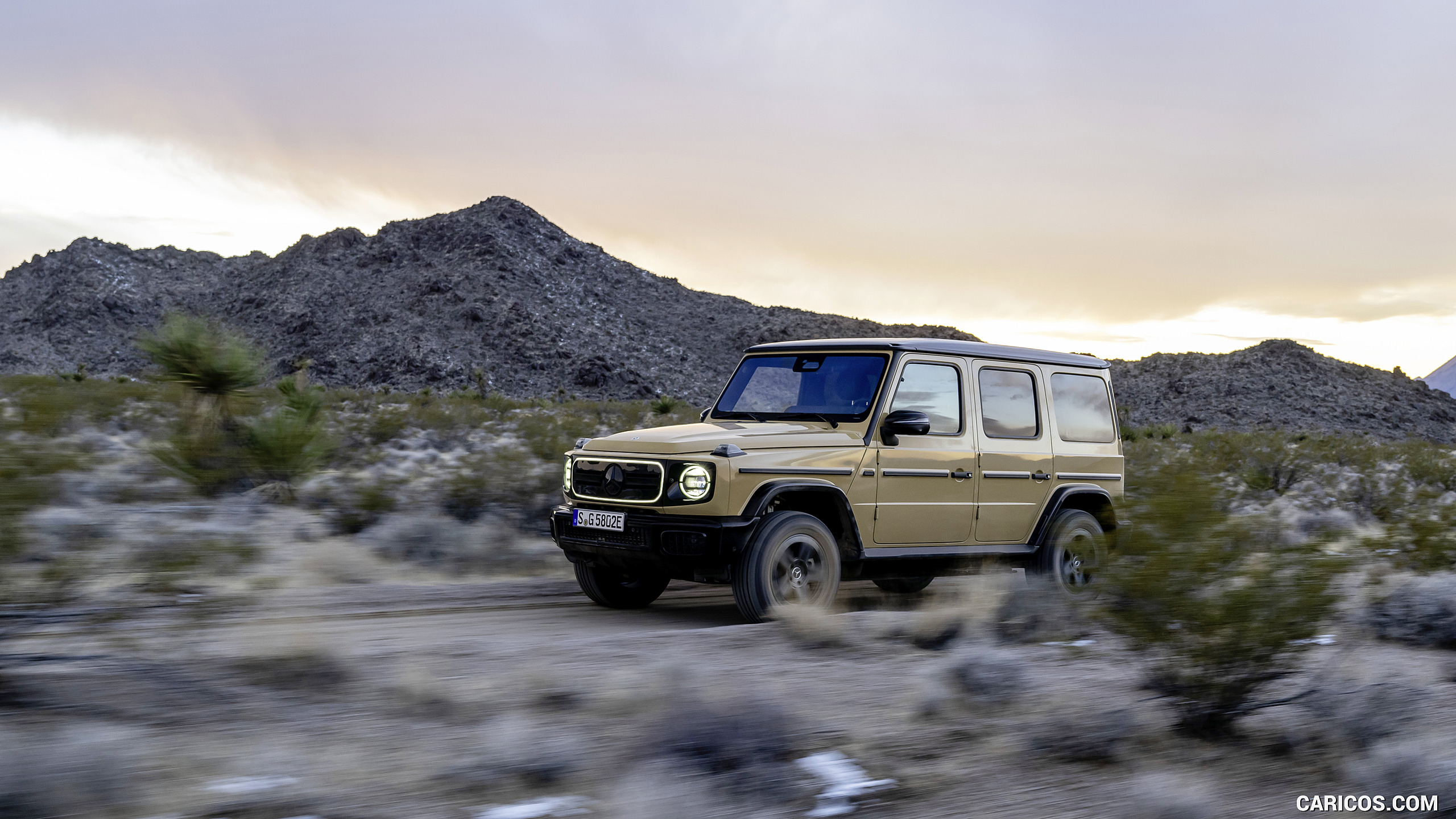 2025 Mercedes-Benz G 580 Electric with EQ Technology (Color: MANUFAKTUR Desert Sand Non-Metallic) - Front Three-Quarter, #35 of 227