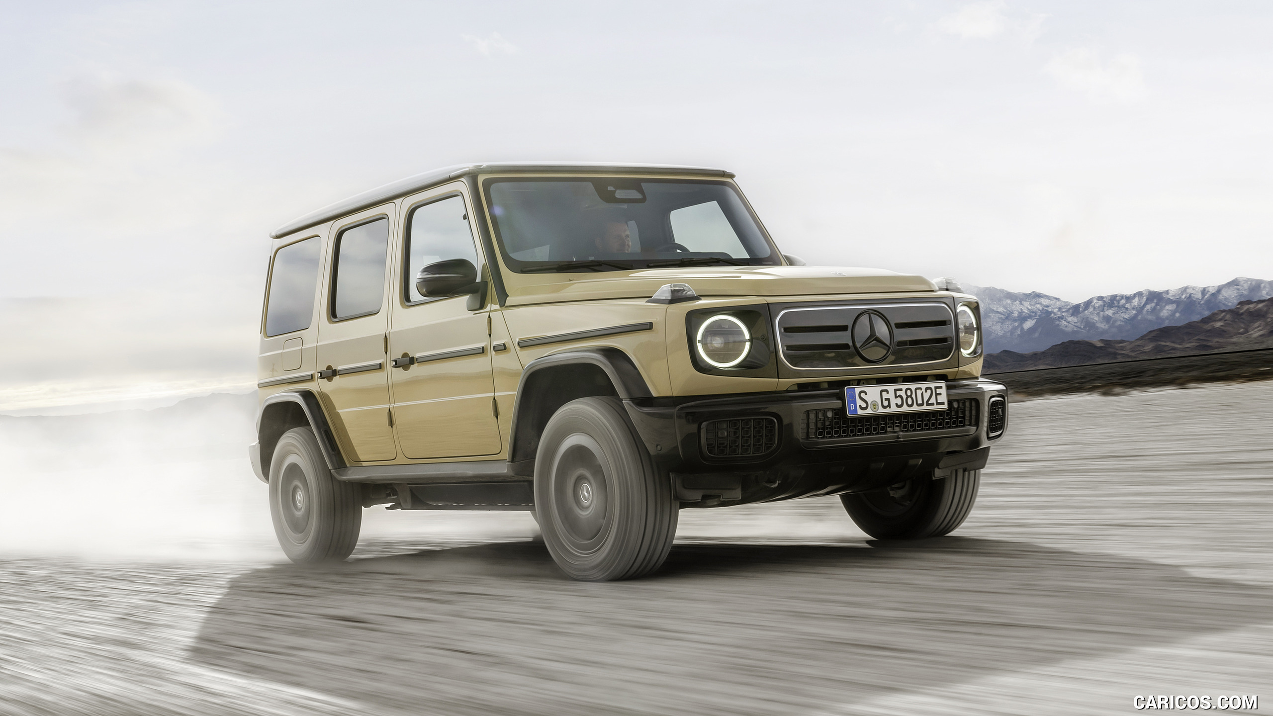 2025 Mercedes-Benz G 580 Electric with EQ Technology (Color: MANUFAKTUR Desert Sand Non-Metallic) - Front Three-Quarter, #42 of 107