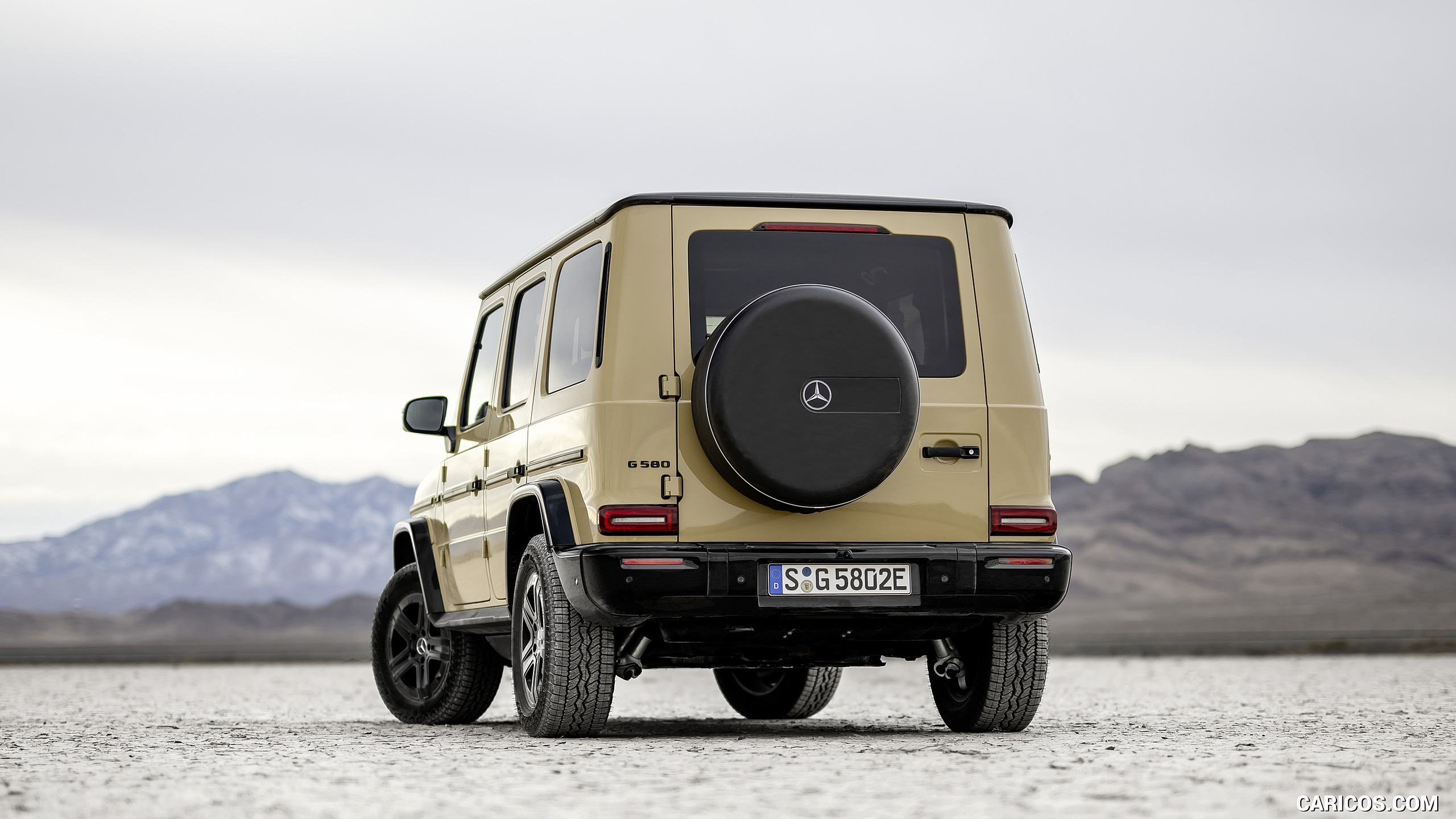 2025 Mercedes-Benz G 580 Electric with EQ Technology (Color: MANUFAKTUR Desert Sand Non-Metallic) - Rear, #49 of 227