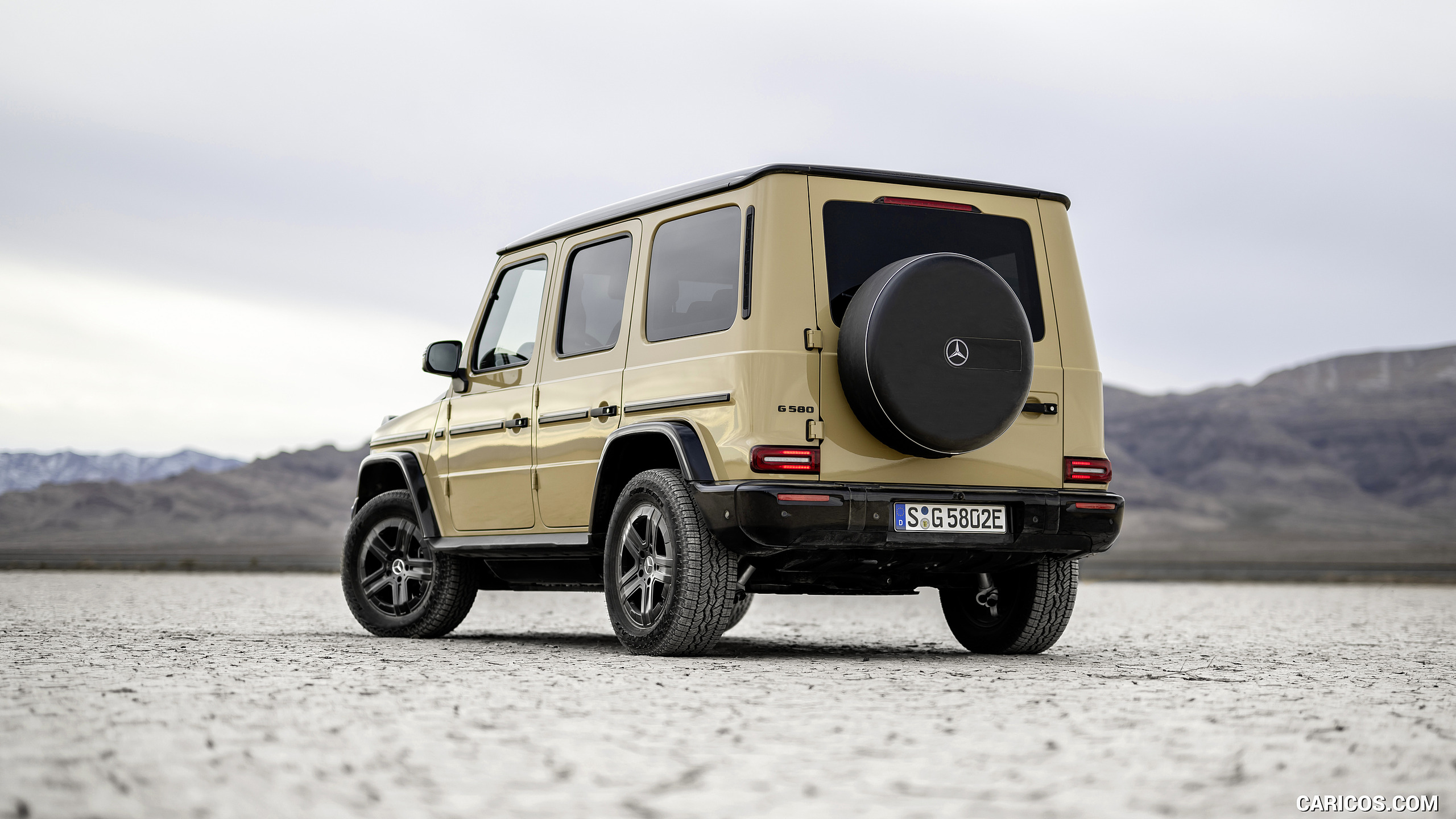 2025 Mercedes-Benz G 580 Electric with EQ Technology (Color: MANUFAKTUR Desert Sand Non-Metallic) - Rear Three-Quarter, #50 of 227