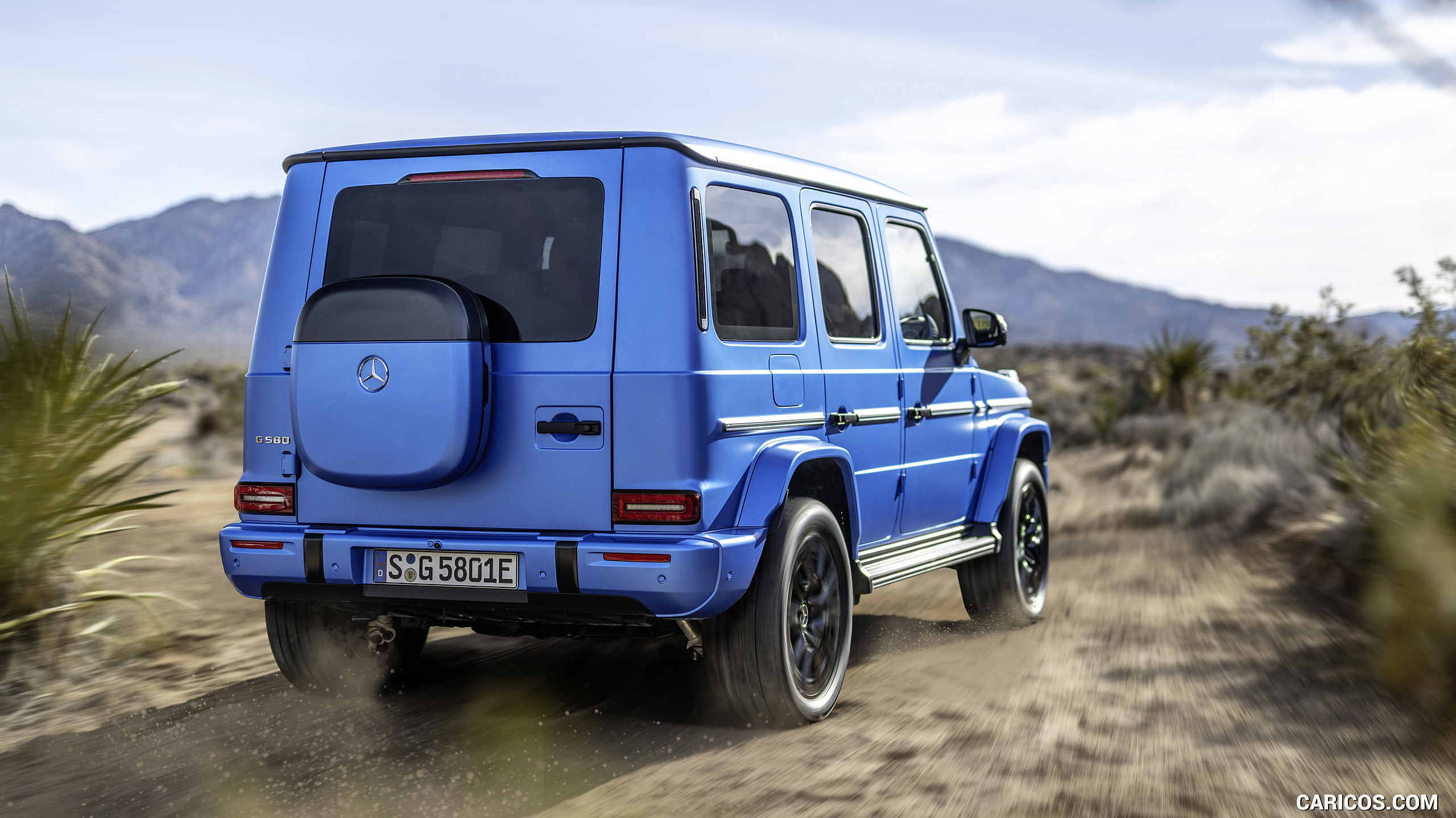 2025 Mercedes-Benz G 580 Electric with EQ Technology Edition One (Color: MANUFAKTUR South See Magno) - Rear Three-Quarter, #7 of 107