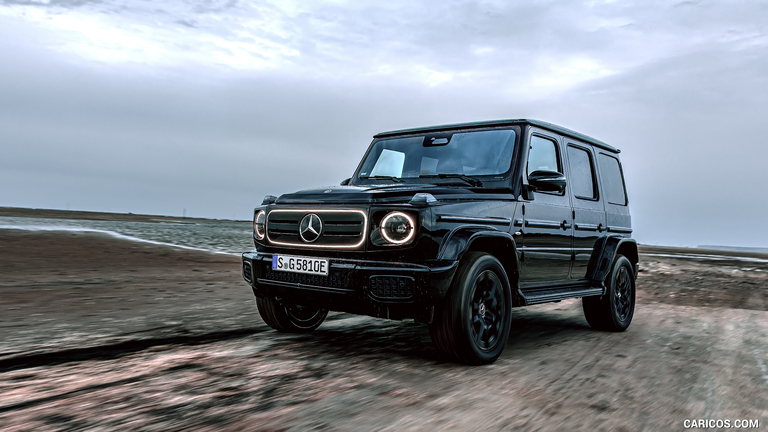 2025 Mercedes-Benz G 580 with EQ Technology (Color: Obsidian Black Metallic) - Front Three-Quarter, #122 of 227